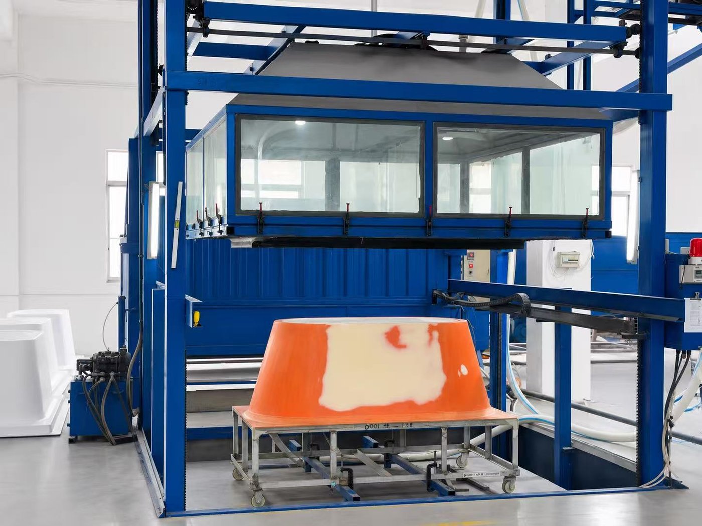 Acrylic sheet forming equipment in operation
